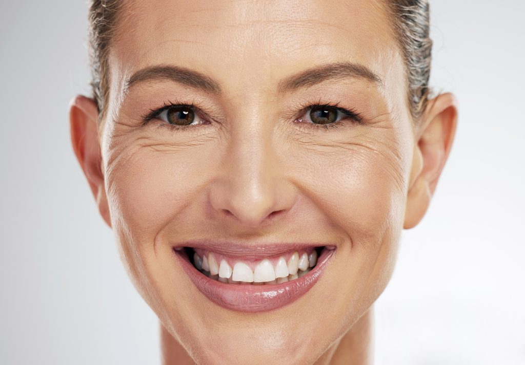 Under Eye Lines in the Face of Mature Woman Smiling | Mizu